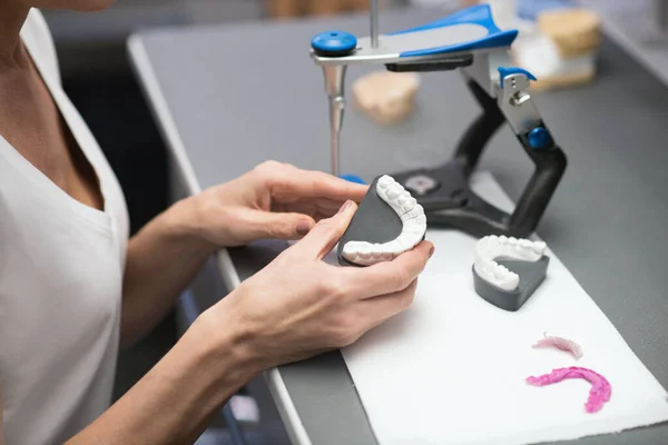 Prothetist working with equipment at the dental clinic — Foto Stock