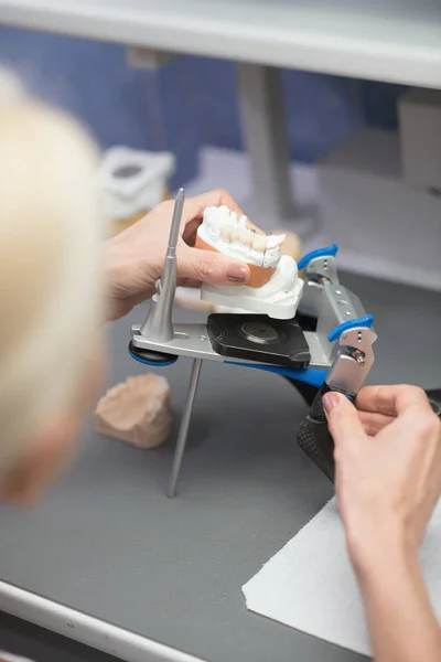 Prosthetist working with equipment at the dental clinic — Foto Stock