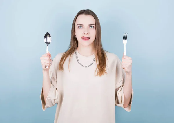 Hungry Girl Holds Fork Spoon Her Hands Licks Her Lips Stock Picture