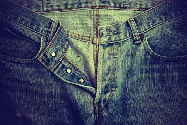 Unbutton the denim jeans pants. — Stock Photo, Image