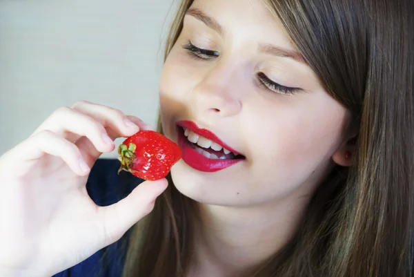 Beautiful teenage girl with strawberry — Stock Photo, Image