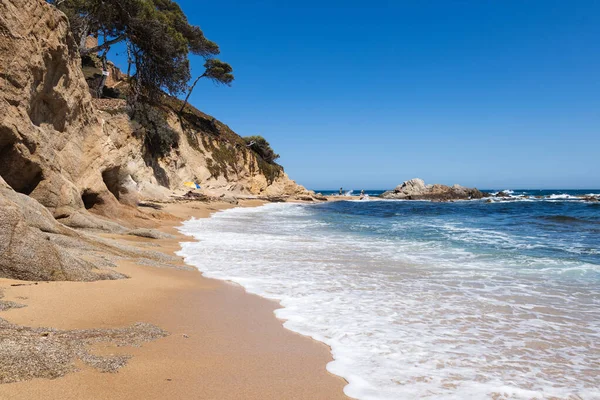 stock image Cala estreta in Palamos, Costa Brava, Spain, sandy beach with sea and rocky mountain