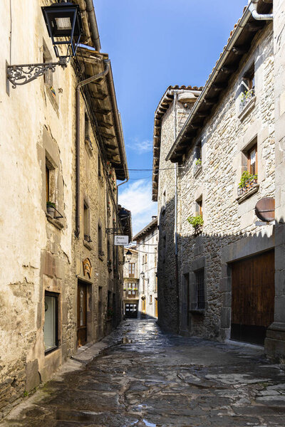 Empty street of medieval spanish village Rupit, old stone street in Catalonia, Spain