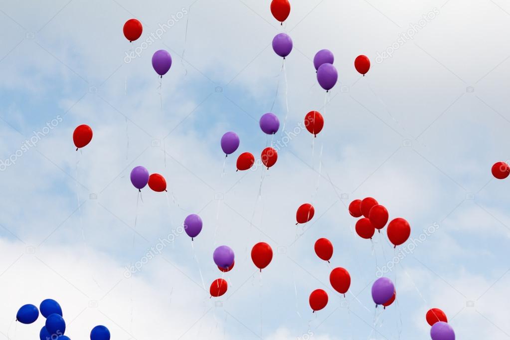 Flying red and blue balloons