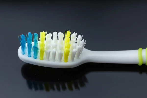 Macro shot toothbrush on black background — Stock Photo, Image