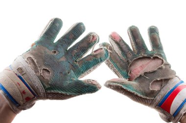 Old Torn Gloves and Hands of the Soccer Goalkeeper Isolated on White Background clipart