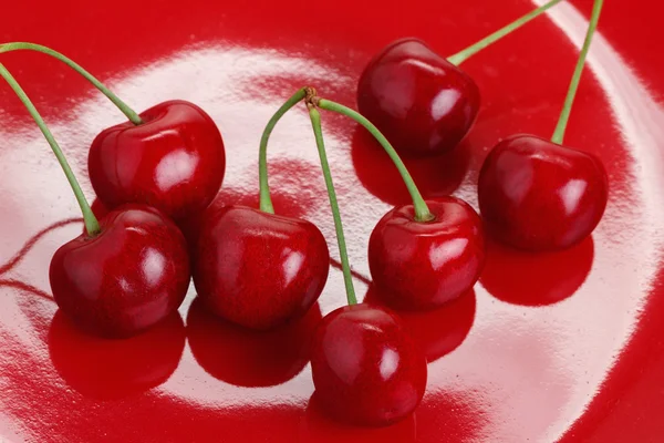 Cherry on a Red Dish — Stok fotoğraf