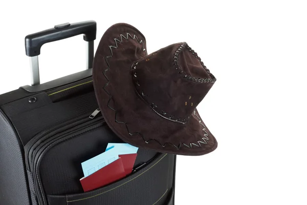 Suitcase with hat on it isolated against a white background. Travel concept — Stock Photo, Image