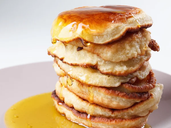 Stack of pancakes, syrup isolated on white background — Stock Photo, Image