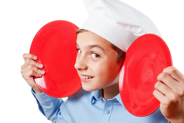 Young chef like a monkey grimassy, humor, chef's hat. Isolated studio — Stock Photo, Image