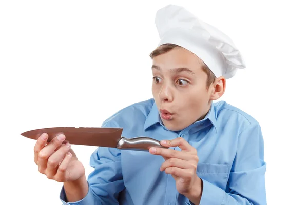 Young chef really surprised failure with a knife. Isolated studio — Stock Photo, Image