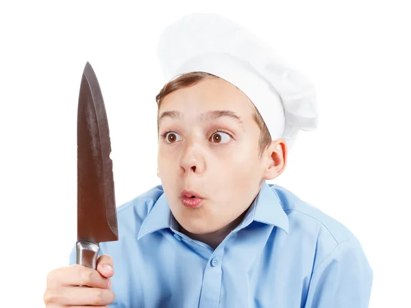 Young chef really surprised failure with a knife. Isolated studio — Stock Photo, Image