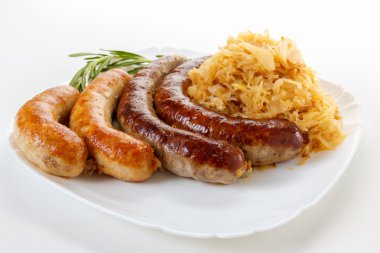 Oktoberfest menu, plate of sausages and sauerkraut clipart