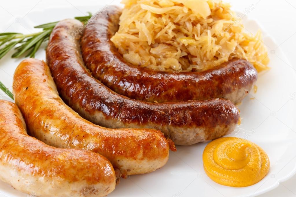 Traditional Oktoberfest menu, plate of sausages and sauerkraut