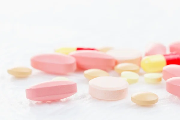 Multicolored Tablets of medicine on white background. — Stock Photo, Image