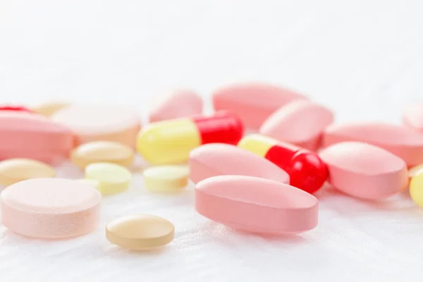 Multicolored Tablets of medicine on white background. — Stock Photo, Image