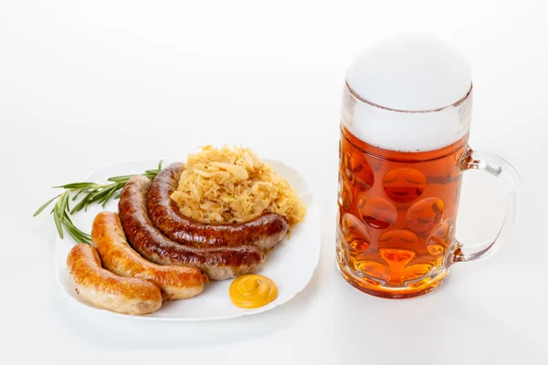 Oktoberfest menu, beer mug, a plate of sausages and sauerkraut — Stock Photo, Image