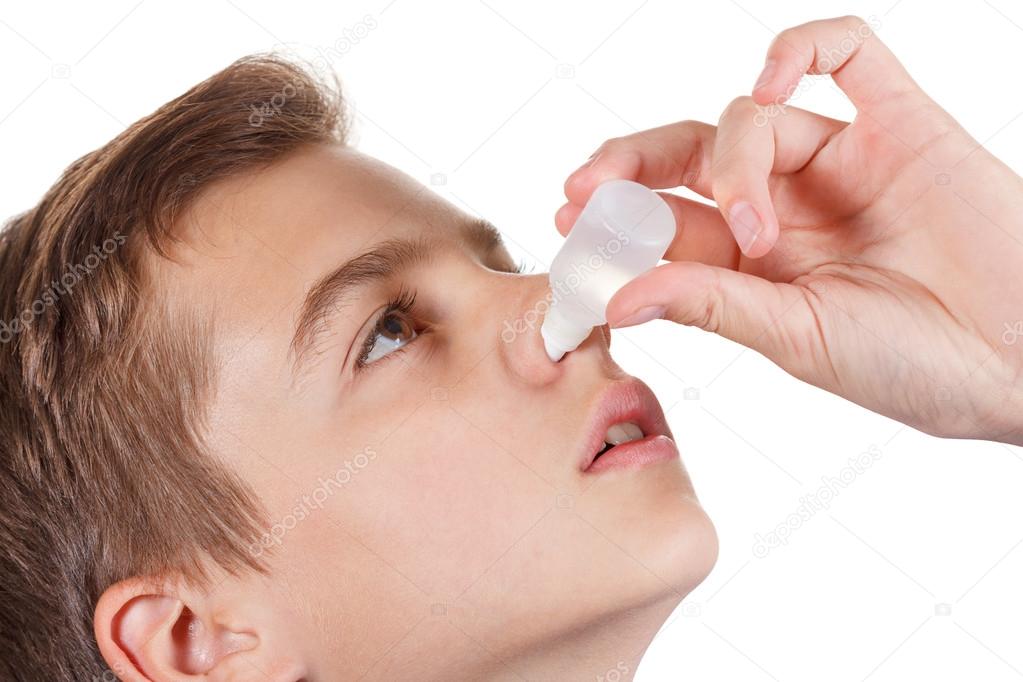 Boy drips medical nose drops
