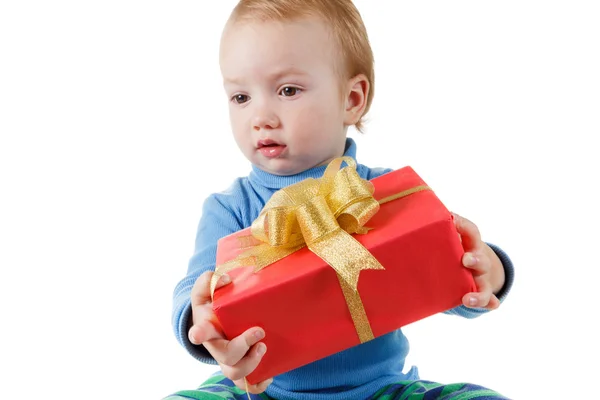 Cute little boy opens a gift box and rejoices, isolated on white — Stock Photo, Image