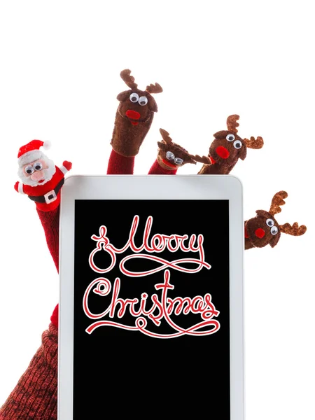 Рождественская концепция игрушки Санта-Клаус и олени с подарком в руке тачпад — стоковое фото