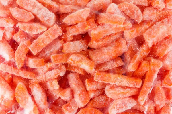 Groupe de carottes congelées, isolées sur blanc — Photo