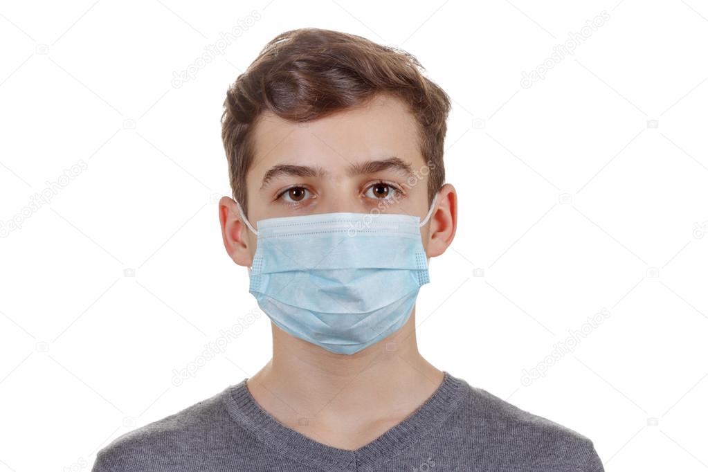 Cute sick boy in a mask