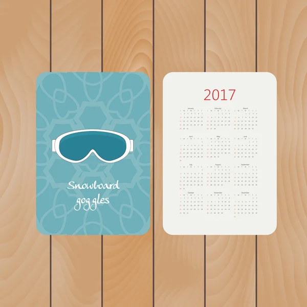 Vector pocket calendar for 2017 with snowboarding goggles. Winter sport decorative illustration in doodle style