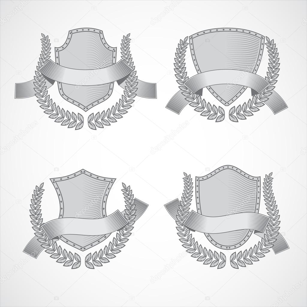 Design elements. Vector set of shields with Laurel wreaths and ribbons. Style of engraving
