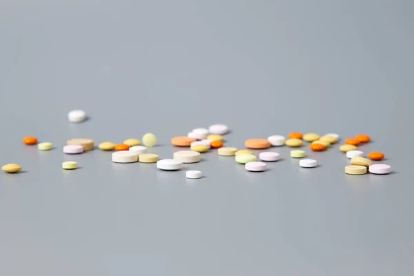 Colorful pills on a gray background — Stock Photo, Image