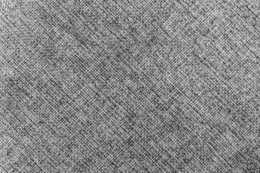 The background is made of woven wool threads in gray and white colors.