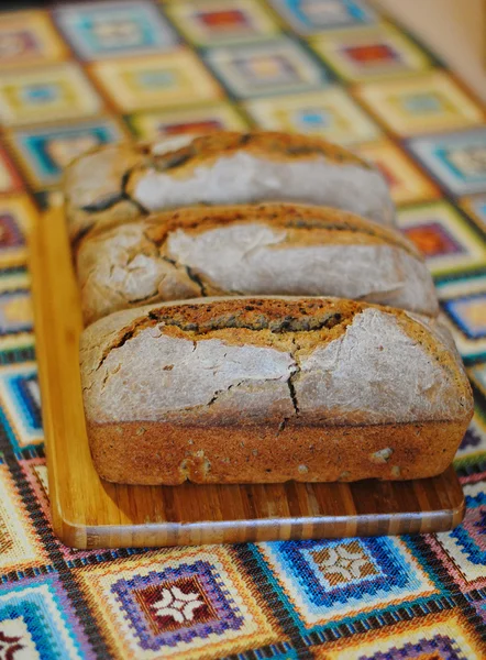 Fresh homemade bread on wooden board — Stock Photo, Image