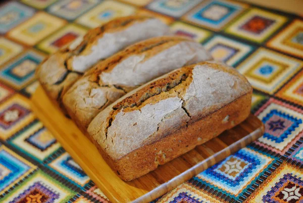 Fresh homemade bread on wooden board — Stock Photo, Image