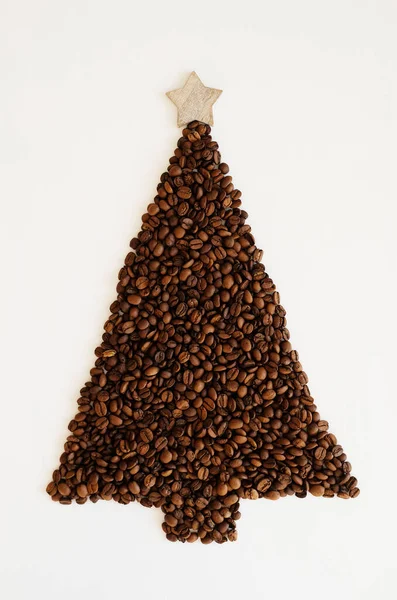 Christmas tree made of coffee beans with wooden star on the top. On white background isolated — Stock Photo, Image