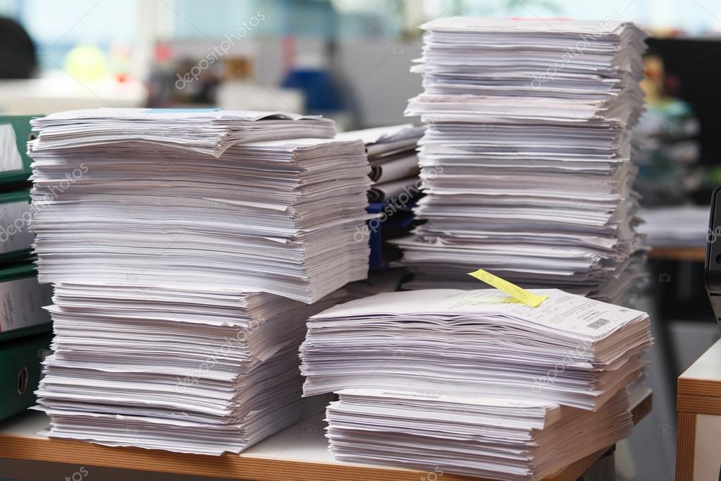 Close Up Stack Of Paper On The Office Desk Stock Photo