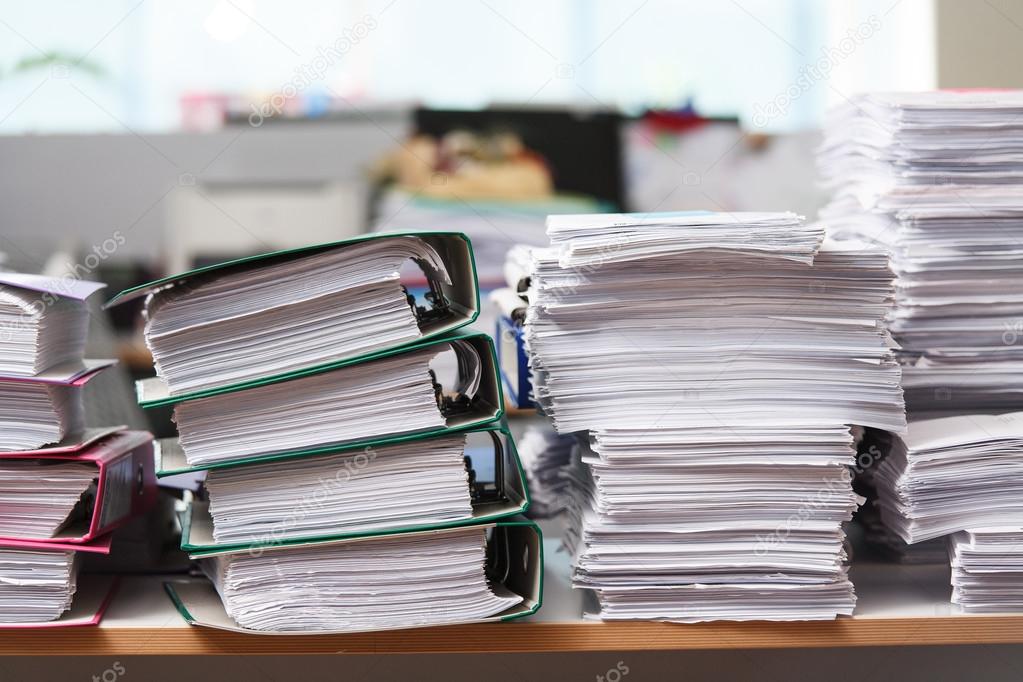 Close Up Stack Of Paper On The Office Desk Stock Photo