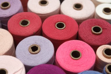 Close up color sewing threads as a background clipart