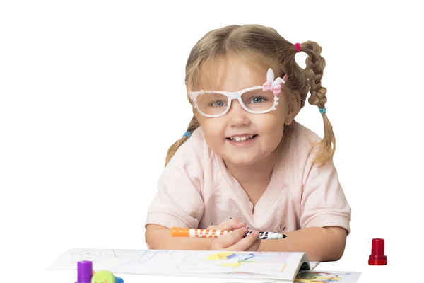 Portrait of a child in glasses with markers. — Stock Photo, Image