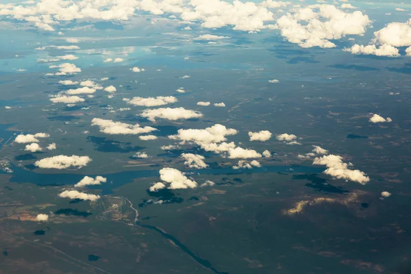 Aerial view of clouds over the land, the landscape. — Stock Photo, Image