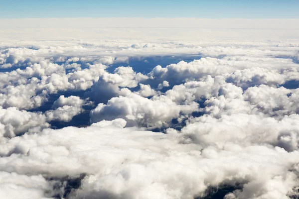 Aerial view of thick clouds over the land, the landscape. — Stock Photo, Image