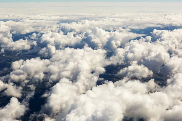 Aerial view of thick clouds over the land, the landscape. — Stock Photo, Image