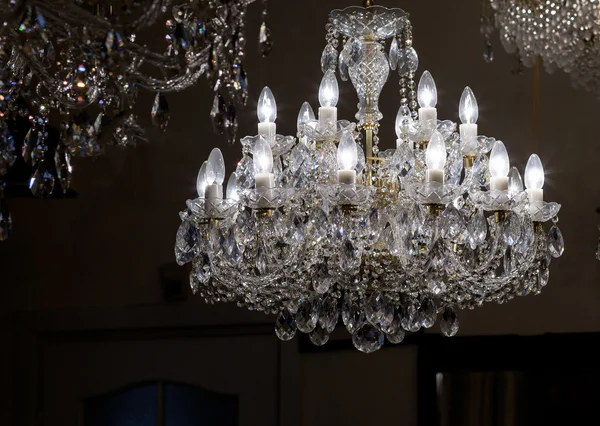 Brass chandelier with crystal.