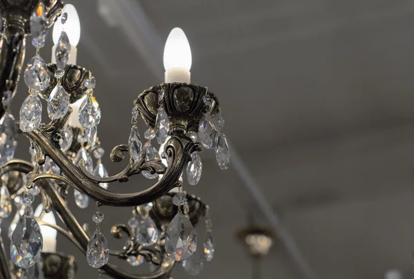 Brass chandelier with crystal.