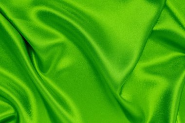 Arkaplan olarak yeşil saten kumaş