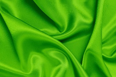 Arkaplan olarak yeşil saten kumaş