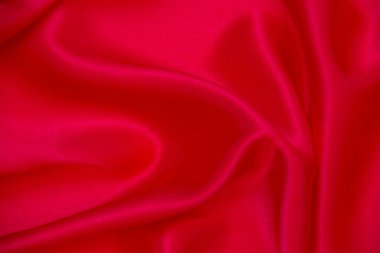 Kırmızı bez dalga arkaplan dokusu.