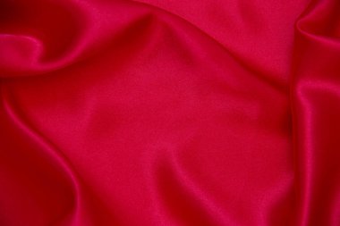 Kırmızı bez dalga arkaplan dokusu.