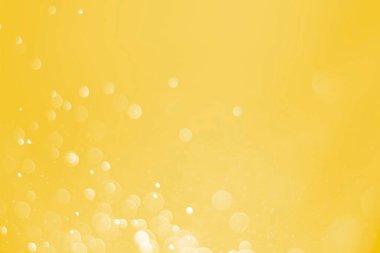 Bokeh odaklı ışıklarla altın soyut arkaplan