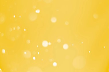 Bokeh odaklı ışıklarla altın soyut arkaplan