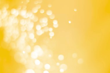 Bokeh odaklı ışıklarla altın soyut arkaplan