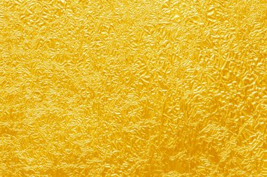 Parlak sarı yaprak altın folyo dokusu arka plan